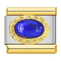 Charm con piedra azul intenso y detalles dorados