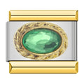 Charm con una piedra verde engarzada
