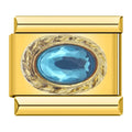 Charm con una piedra azul engarzada
