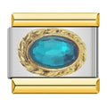 Charm piedra azul engarzada en un diseño dorado