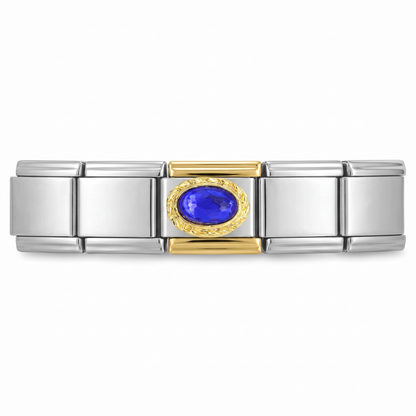 Charm con piedra azul intenso y detalles dorados en pulsera italiana de eslabones